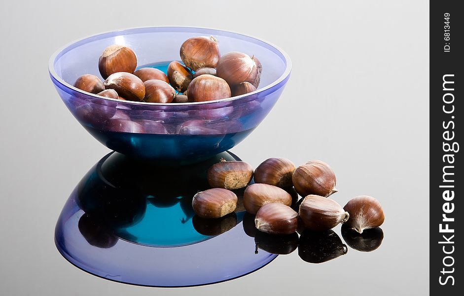 Chestnuts and blue plastic plate