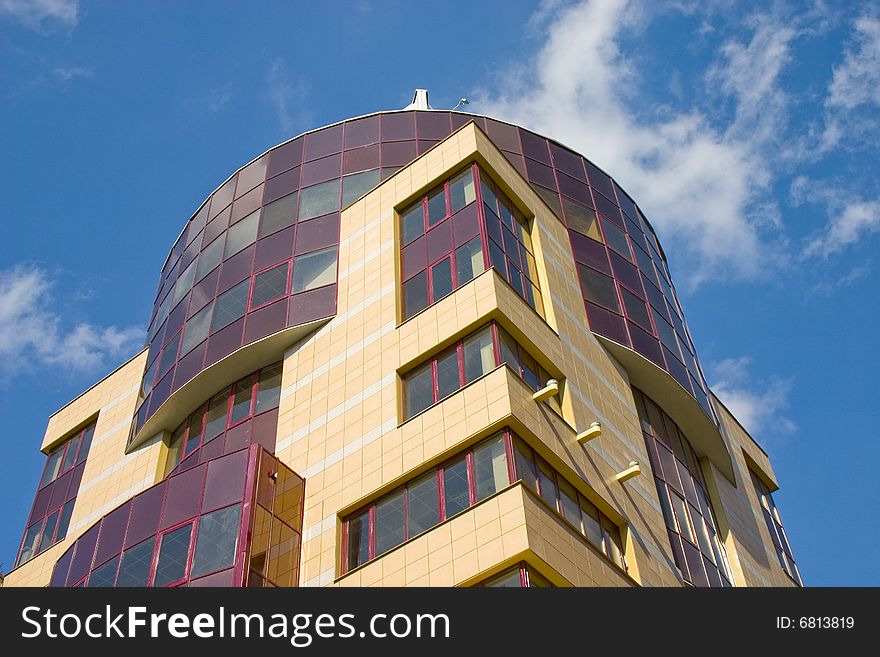 Modern building from a brick. Glass windows and balconies. Modern building from a brick. Glass windows and balconies.