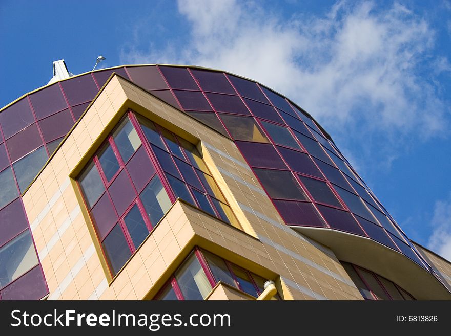 Modern building from a brick. Glass balconies. Modern building from a brick. Glass balconies.