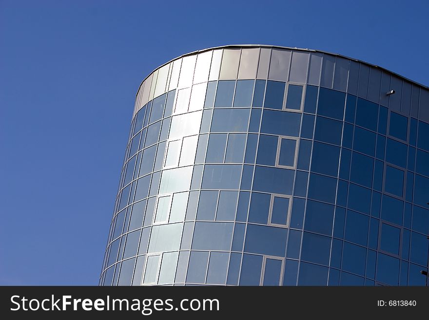 Modern urban building. Glass windows. Modern urban building. Glass windows.