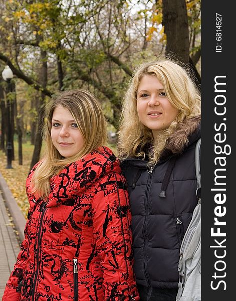 Two young women in a autumn park