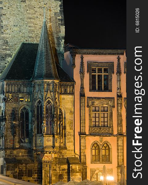 Ancient part of Old Town Hall on Old Town Square in Prague at night lighting.