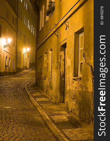 Old lane in Prague Little Quarter at night lighting.