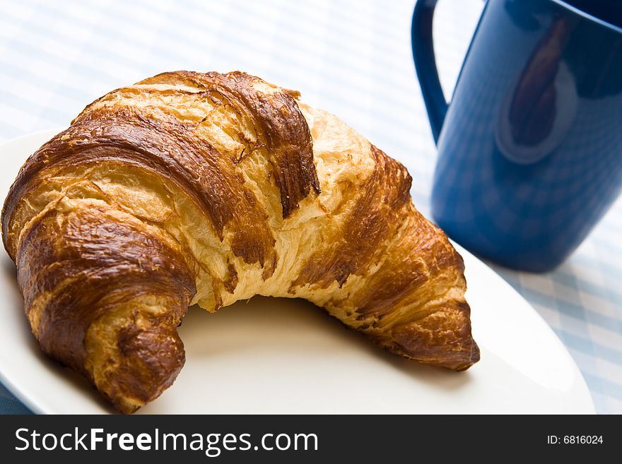 Fresh croissant with a cup of tea. Fresh croissant with a cup of tea