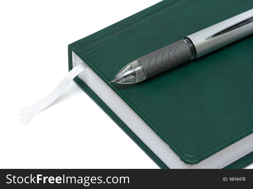 Black pen with notebook isolated on white background