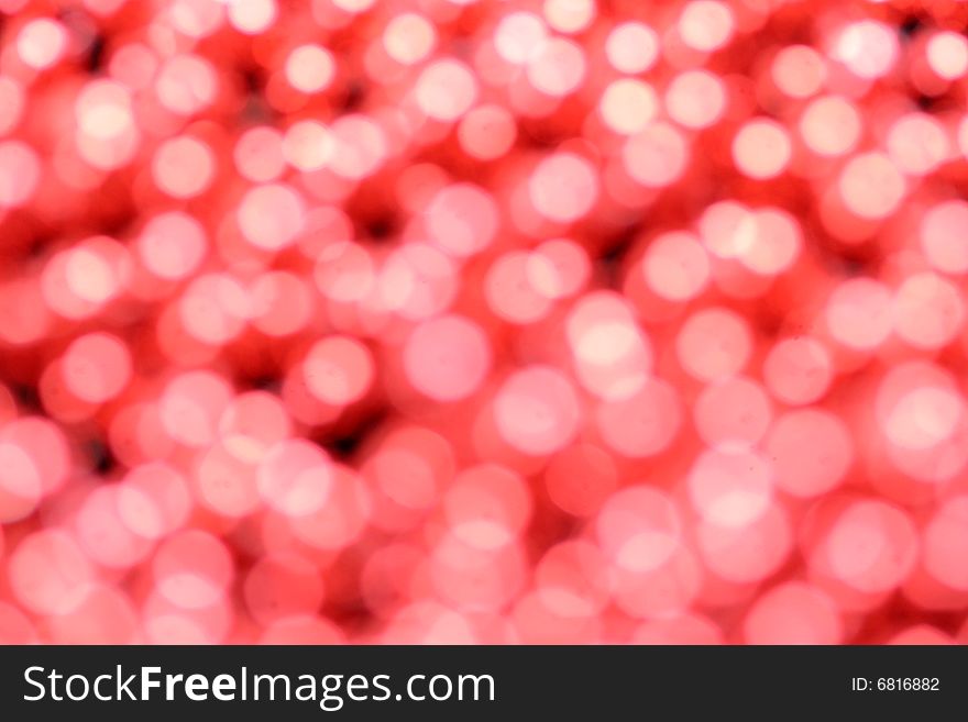 Red bokeh background, ideal for holidays like christmas