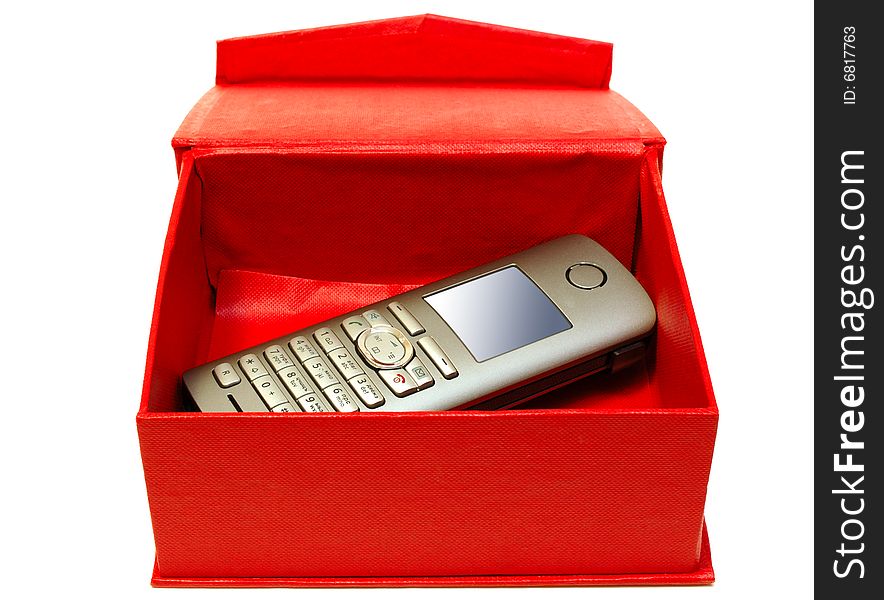 Gray (silver) mobile (radio) telephone and red cardboard box on isolated background. Gray (silver) mobile (radio) telephone and red cardboard box on isolated background.