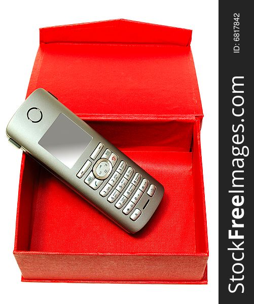 Gray (silver) mobile (radio) telephone and red cardboard box on isolated background. Gray (silver) mobile (radio) telephone and red cardboard box on isolated background.