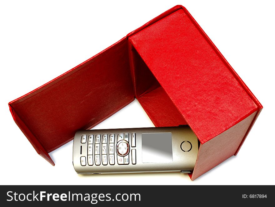 Gray (silver) mobile (radio) telephone and red cardboard box on isolated background. Gray (silver) mobile (radio) telephone and red cardboard box on isolated background.
