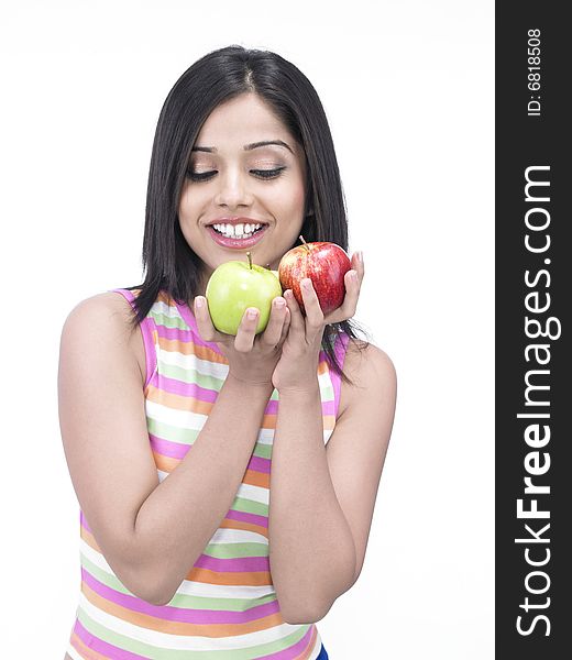 Asian woman with one green and one red apple. Asian woman with one green and one red apple