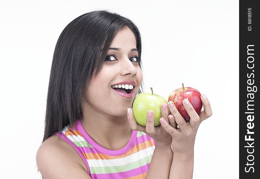 Asian woman with one green and one red apple. Asian woman with one green and one red apple