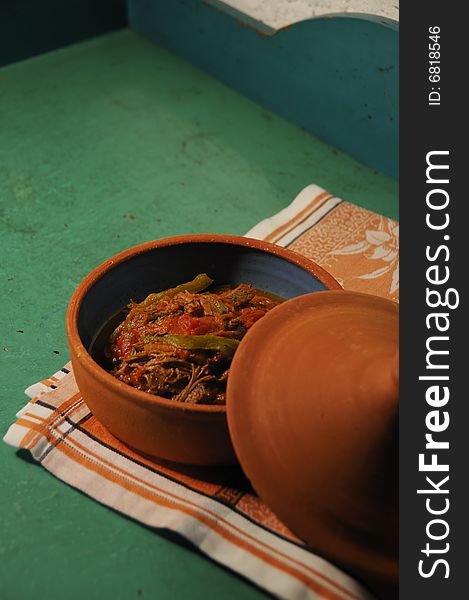 Detail of typical cuban dish over green surface