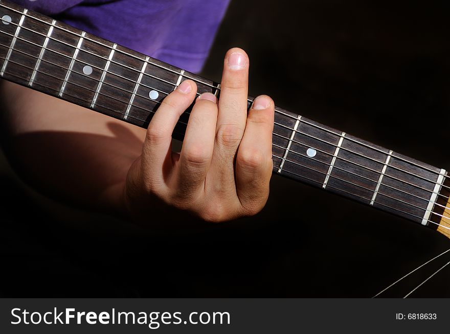Detail of male hands playing electric guitar. Detail of male hands playing electric guitar