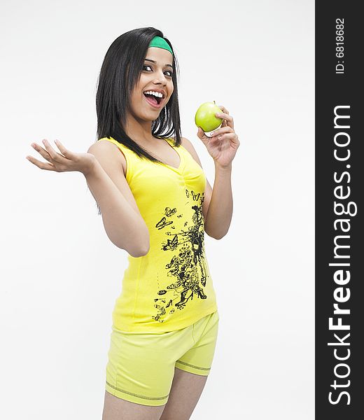 Asian woman eating  a green apple. Asian woman eating  a green apple