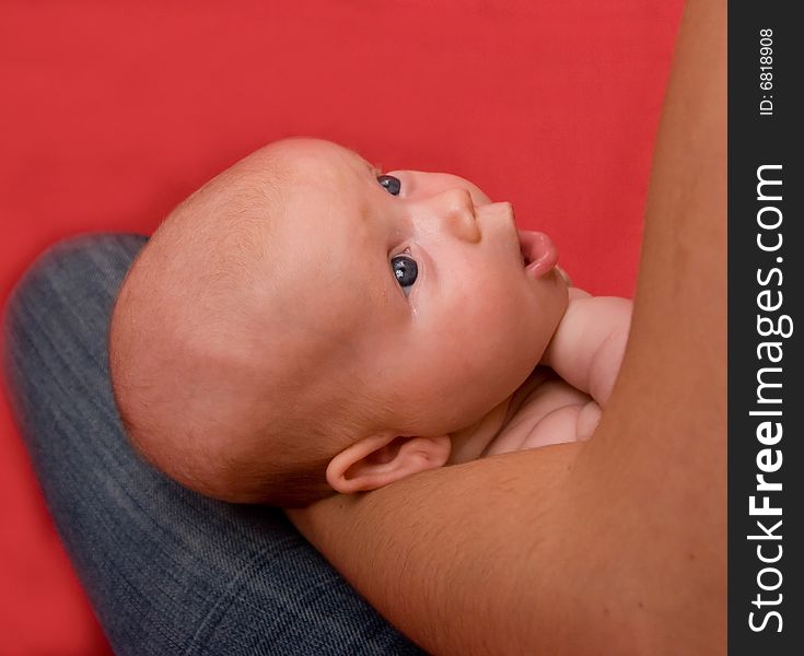 Happy baby with mother over red background. Happy baby with mother over red background