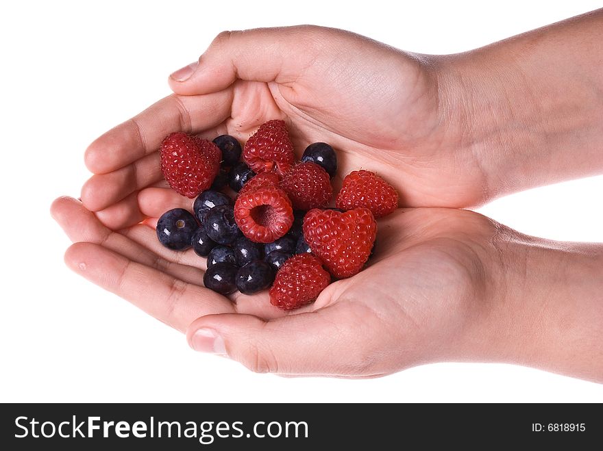 Mixed delicious fresh organic blueberries raspberries in two cupped hands. Mixed delicious fresh organic blueberries raspberries in two cupped hands