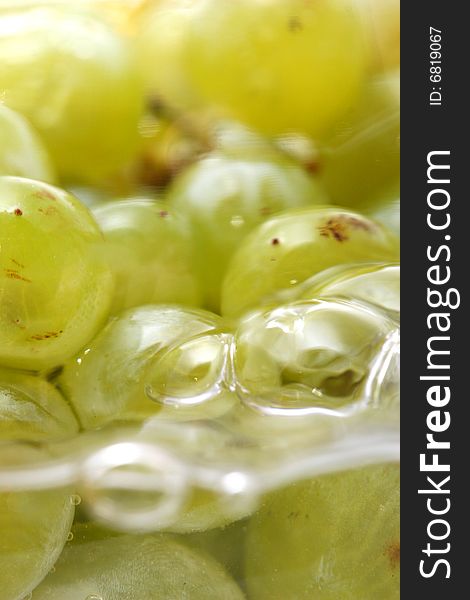 Close-up of grapes in water as a healthy food concept