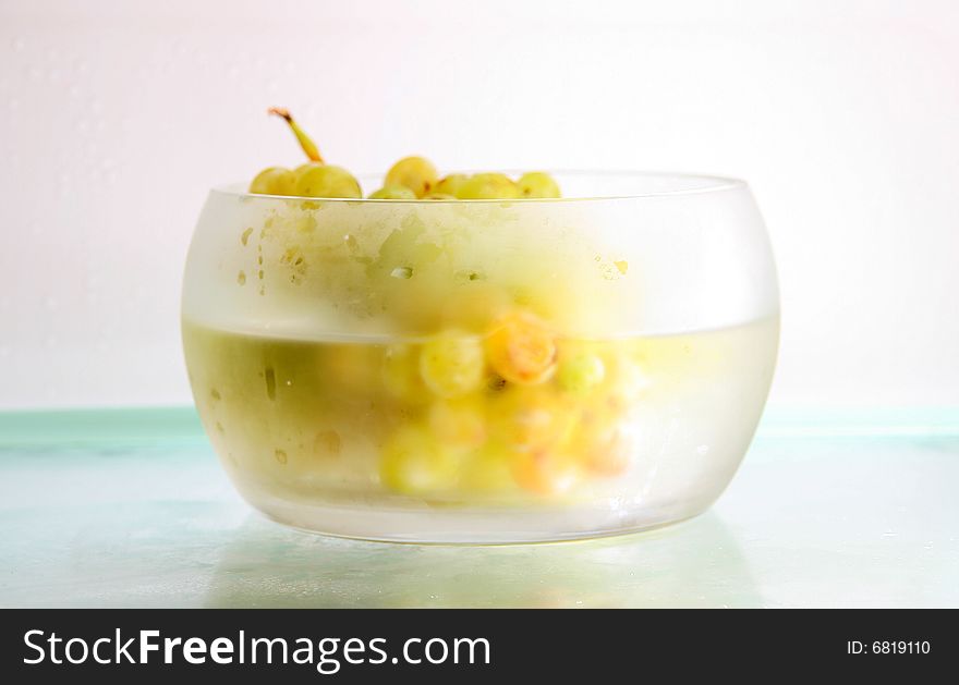 Close-up of grapes in a glass bowl in a fridge. Close-up of grapes in a glass bowl in a fridge