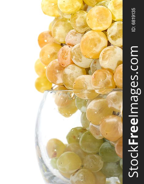 Close-up of grapes in a glass bowl on white background. Close-up of grapes in a glass bowl on white background