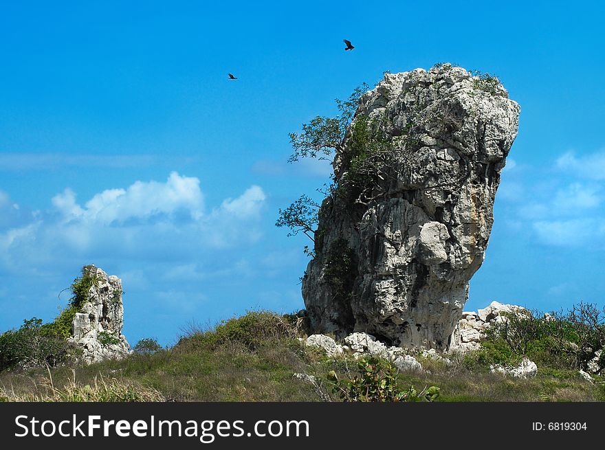 Landscape with natural large rock formation against blue sky. Landscape with natural large rock formation against blue sky