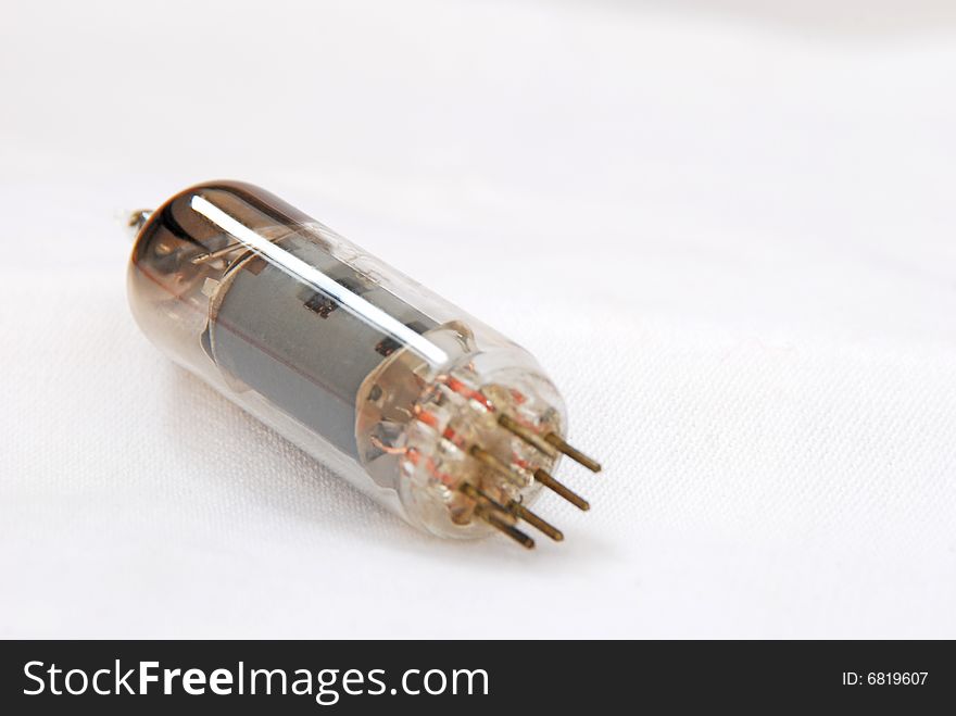 Vacuum radio tube on white background. Vacuum radio tube on white background