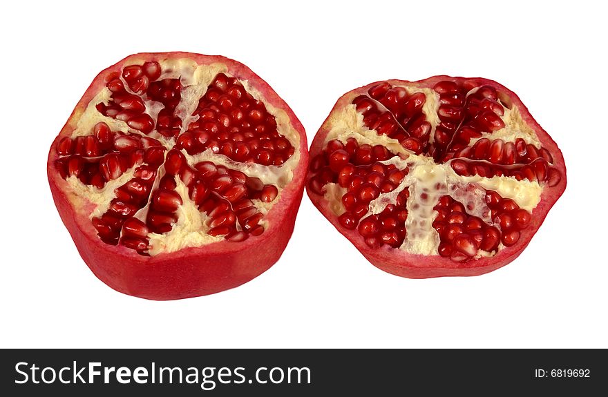 The red cut pomegranate on a white background
