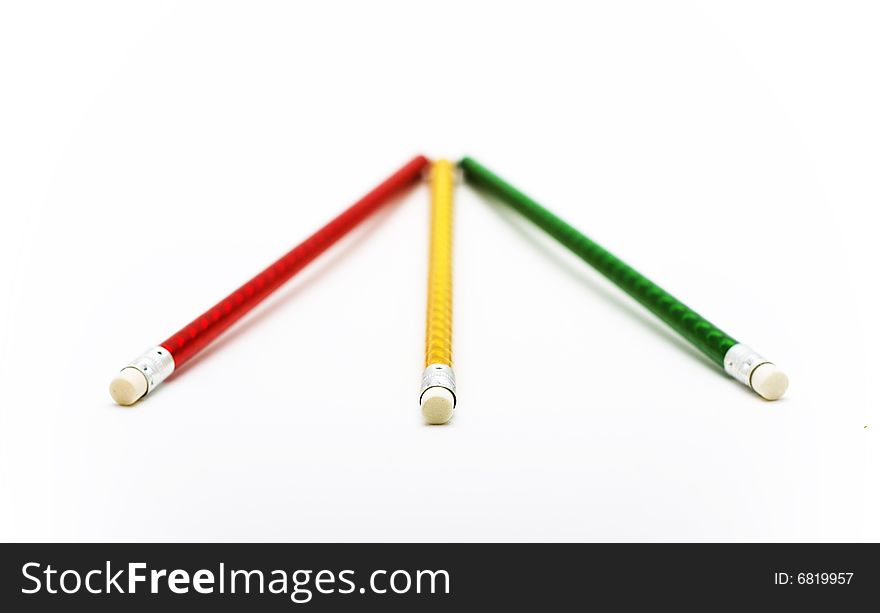 Three colorful pencils close-up isolated on white background