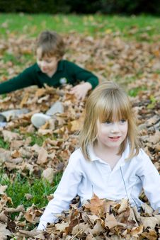 Playing In The Autumn Leaves Stock Images Playing In The Autumn Leaves Stock Images