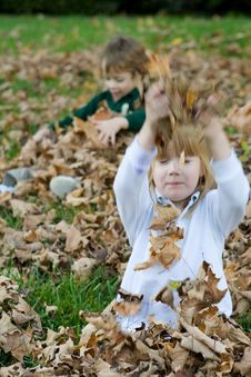 Playing In The Autumn Leaves Royalty Free Stock Photo Playing In The Autumn Leaves Royalty Free Stock Photo