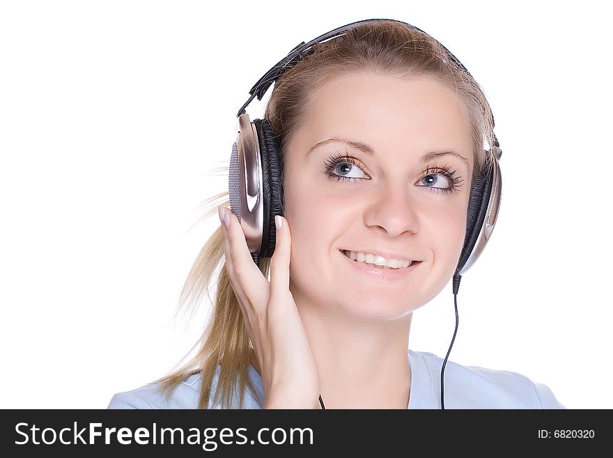 Isolated smiling young girl listening to music. Isolated smiling young girl listening to music