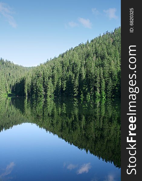 A mountain landscape with clear lake on a foreground. A mountain landscape with clear lake on a foreground