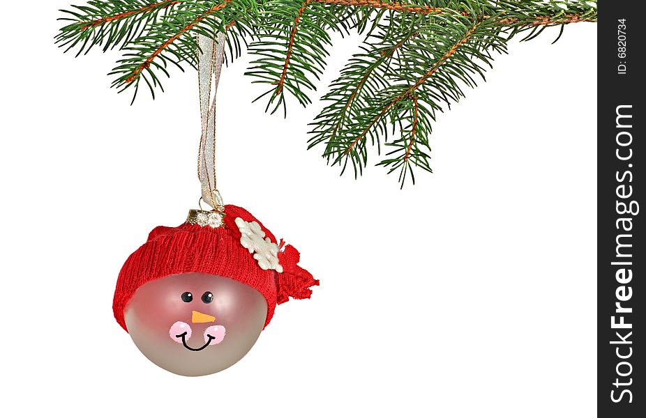 Christmas ornament hanging from an evergreen branch with copy space