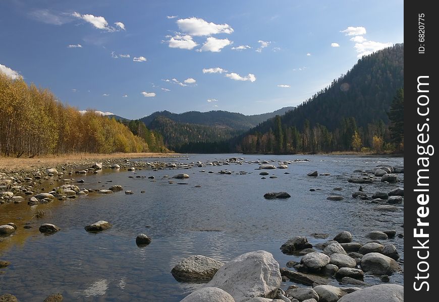 River Biya, mountains and blue sky.