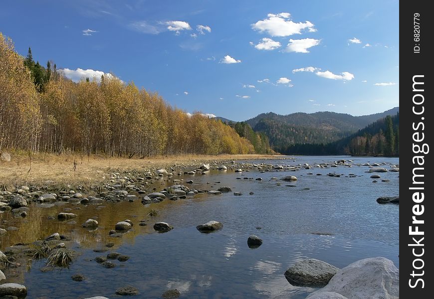 River Biya, Mountains And Blue Sky.