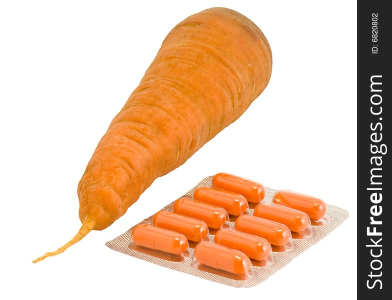 Vitamin pills with carrot on isolated white. Make your choice. Vitamin pills with carrot on isolated white. Make your choice