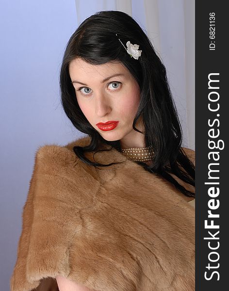 Retro fifties pin-up attractive girl in fur wrap on colorful background - pin-up concept. Retro fifties pin-up attractive girl in fur wrap on colorful background - pin-up concept