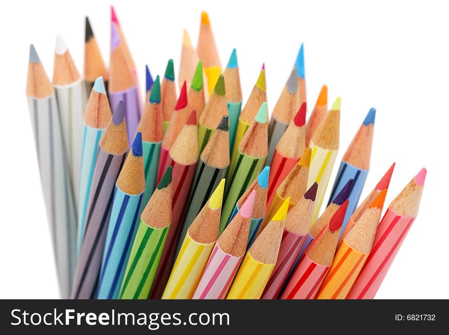 Close up of color pencils with different color over white background.