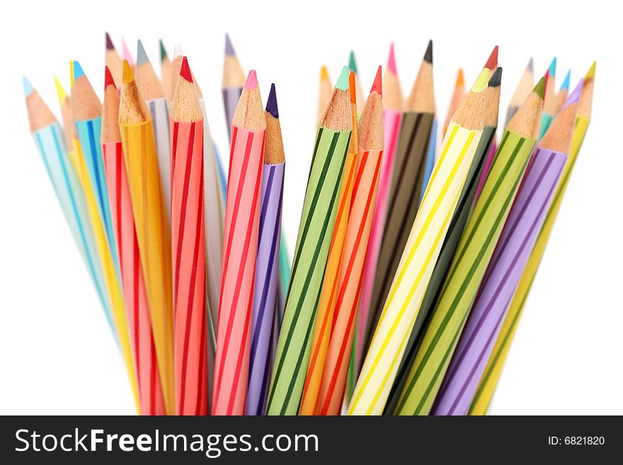 Close up of colorful color pencils over white background.