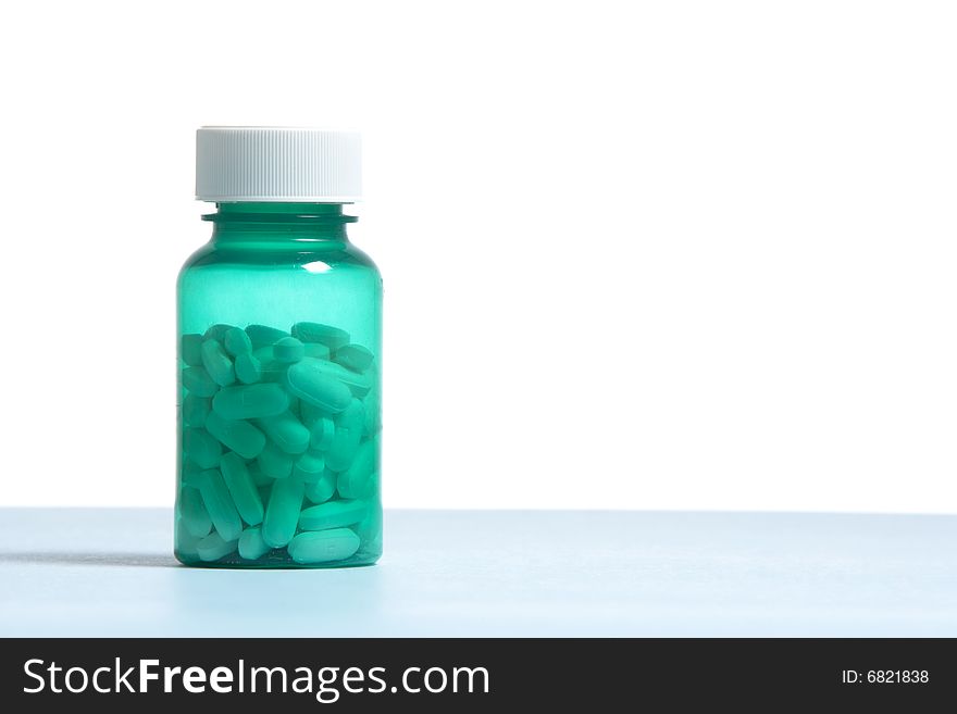 A bottle filled with pills in the studio