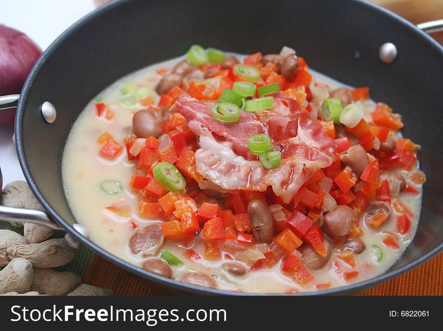 A soup of beans with vegetables and spices