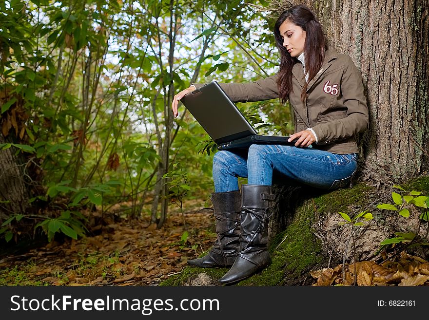 Young woman on autumn forest under chestnut tree. Young woman on autumn forest under chestnut tree