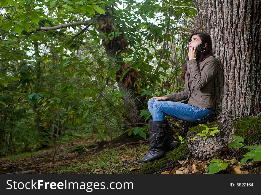 Young woman on autumn forest under chestnut tree. Young woman on autumn forest under chestnut tree