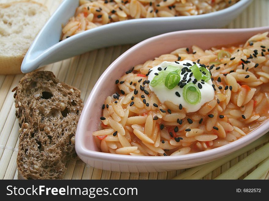 Some greg rice noodles with tomato sauce