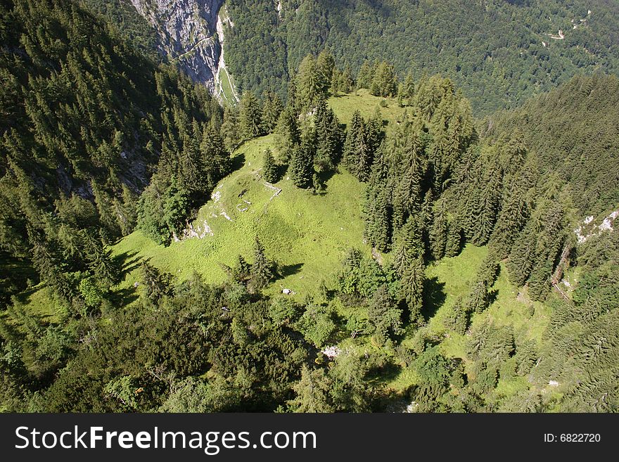 Afraid of heights? This picture was taken at the Zugspitze mountain in Germany near Alpspitze nearly vertical from on high, in the Background you can see the Höllental (Höllentalklamm), major route to the mountain peak of the Zugspitze (highest german mountain)