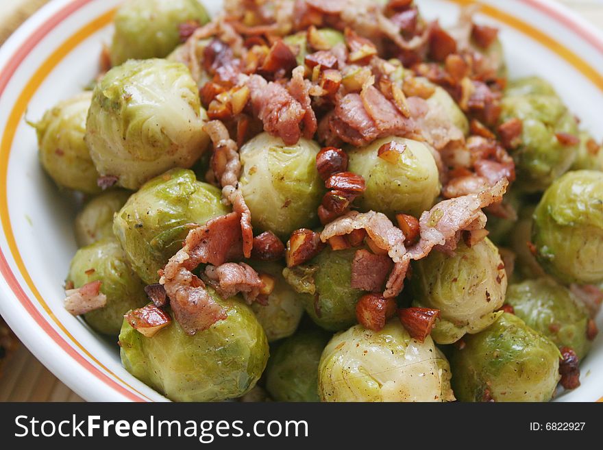 Fresh cabbage with some bacon and almonds