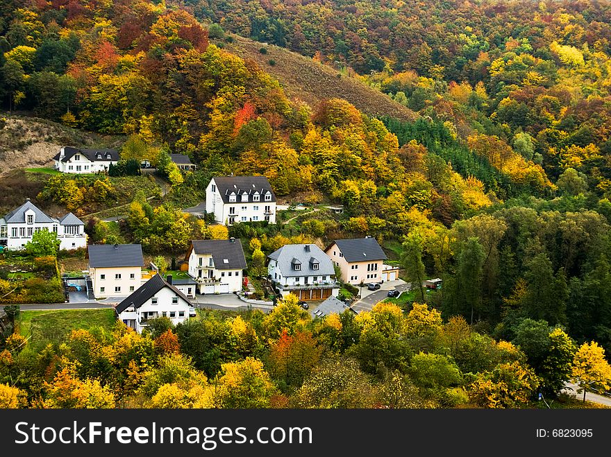 Colorful autumn forest  and village along the mosel river in germany