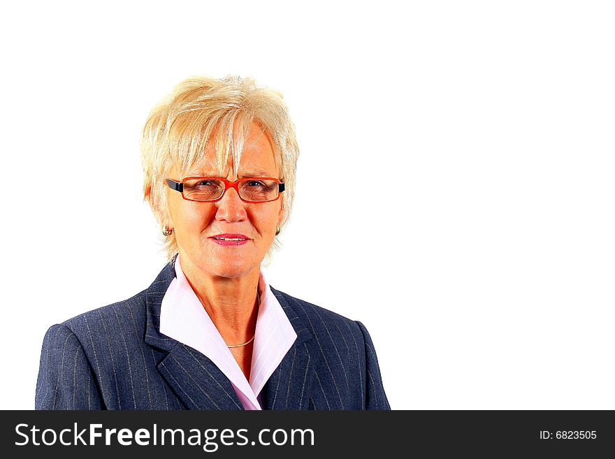 A businesswoman in her sixties with glasses and a suit. Isolated over white. A businesswoman in her sixties with glasses and a suit. Isolated over white.