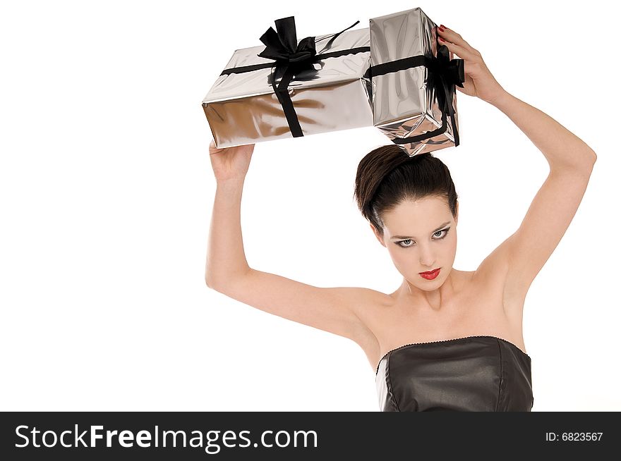 Young woman holding Christmas gifts above her head