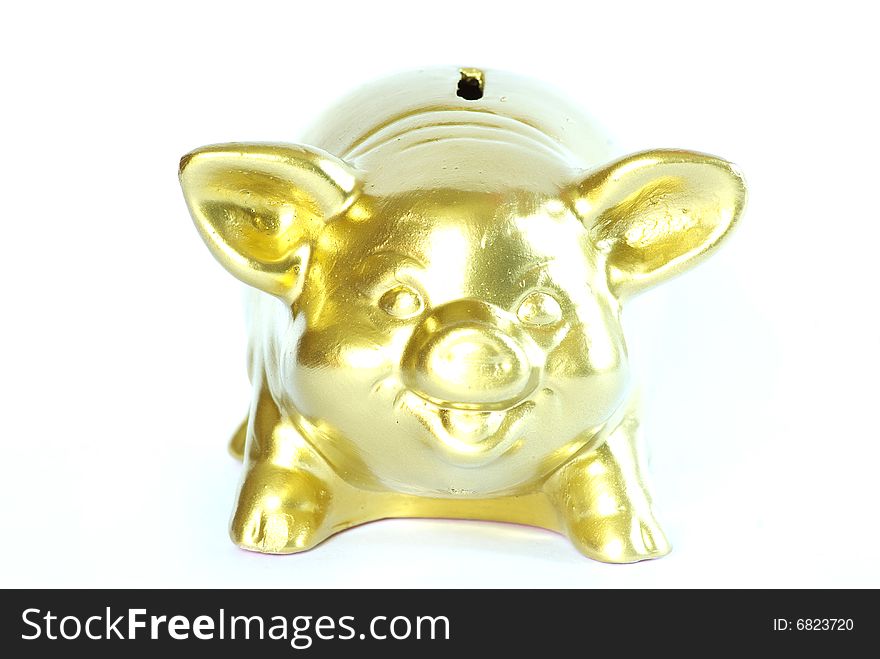 Golden piggy bank isolated on white