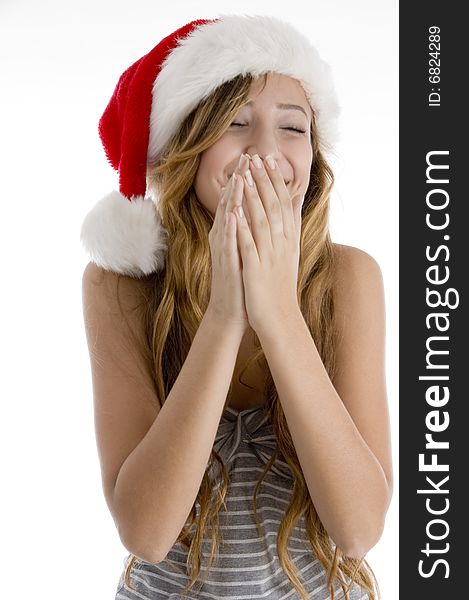 Front view of laughing girl with christmas hat on  an isolated white background